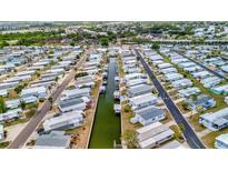 An aerial view of a waterfront community with canals and neatly arranged mobile homes at 119 E Saint Johns Way, Apollo Beach, FL 33572