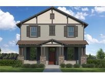 Charming two-story home with stone accents, neutral siding, shutters, covered porch, and professionally landscaped yard at 1526 W Arch St, Tampa, FL 33607