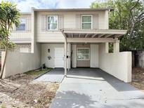 Charming townhouse with covered parking and neutral color scheme at 5118 Tennis Court Circle, Tampa, FL 33617