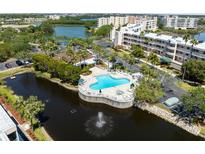 Breathtaking aerial view of the community pool overlooking the water and tropical landscape at 6205 Shoreline Dr # 1204, St Petersburg, FL 33708