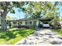 Charming single story home with covered carport and mature landscaping at 6350 55Th N Ave, St Petersburg, FL 33709