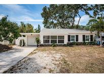 Charming single-story home featuring black shutters and large windows for plenty of natural light at 8054 38Th N Ave, St Petersburg, FL 33710