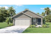 Inviting single-story home featuring a well-manicured lawn and an attached two-car garage at 1004 Spotted Egret Loop, Ruskin, FL 33570