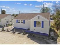 Charming home showcasing a classic design and blue accents, in a sunny neighborhood setting at 101 146Th Ave, Madeira Beach, FL 33708