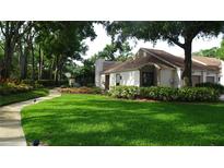 Charming single-story home with well-manicured lawn and lush landscaping, providing a welcoming curb appeal at 11519 Galleria Dr, Tampa, FL 33618