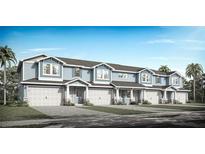 Charming new townhomes with covered entry, two-car garages, and lush landscaping in a vibrant community at 2533 Mario Way, Clearwater, FL 33761