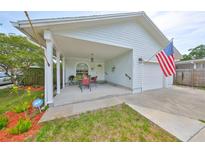 Charming single-story home with a welcoming front porch and well-maintained lawn, perfect for relaxing outdoors at 3042 57Th N Ave, St Petersburg, FL 33714