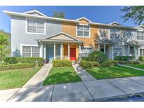 Charming townhomes featuring colorful exteriors and well-maintained landscaping at 3456 High Hampton Cir, Tampa, FL 33610