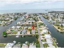 Stunning aerial view of waterfront property with access to canal and beautiful views at 4396 5Th Isle Dr, Hernando Beach, FL 34607