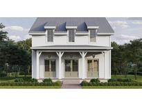 Charming two-story home with inviting front porch, classic design and green doors at 510 35Th N Ave, St Petersburg, FL 33704