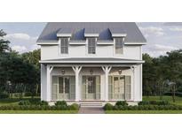 Charming two-story home featuring a covered front porch and classic architectural details at 510 35Th N Ave, St Petersburg, FL 33704