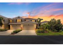 Beautiful exterior of home featuring multi-car garage, well-manicured landscaping, and stunning sunset at 582 53Rd N Ave, St Petersburg, FL 33703