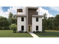 Modern three-story home featuring a bright yellow front door, clean lines and neutral colors, surrounded by lush landscaping at 801 N Oregon Ave, Tampa, FL 33606