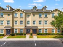 Attractive exterior of the multi-Gathering home with parking, manicured landscaping, and decorative doors at 10144 Arbor Run Dr # 139, Tampa, FL 33647