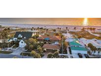 A captivating beachfront home offering stunning ocean views and direct access to a pristine sandy beach at 1058 Eldorado Ave, Clearwater Beach, FL 33767
