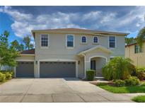 Charming home with a three-car garage and well-maintained landscaping at 2463 Carnation Ct, North Port, FL 34289