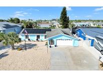 Charming single-Gathering home with solar panels, well-manicured landscaping and a two-car garage at 1015 Spindle Palm Way, Apollo Beach, FL 33572
