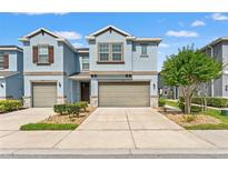Inviting two-story townhome with well-manicured landscaping and a two-car garage at 6731 Rocky Park St, Tampa, FL 33625
