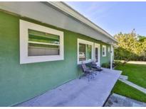 Inviting home exterior with a covered patio and comfortable seating at 6904 11Th Ave E, Palmetto, FL 34221