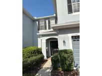 Charming two-story home with a well-maintained lawn and neutral exterior paint at 20548 Grand Vista Ln, Tampa, FL 33647