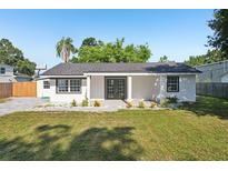 Charming single-story home with a well-maintained lawn and minimalist landscaping, offering great curb appeal at 2288 Cheryl Rd, Largo, FL 33771