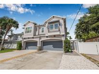Beautiful two-story home with a two-car garage and manicured landscaping at 307 S Gomez Ave # 1, Tampa, FL 33609