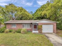 Charming one-story brick home featuring a well-maintained lawn and mature landscaping at 1139 3Rd Nw Ave, Largo, FL 33770