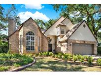 Charming two-story home with brick accents, arched windows, and a well-manicured lawn at 13785 Oak Forest S Blvd, Seminole, FL 33776