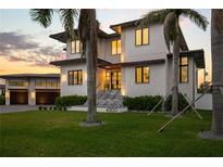Stunning two-story home with lush landscaping and palm trees at 4300 Bayshore Ne Blvd, St Petersburg, FL 33703
