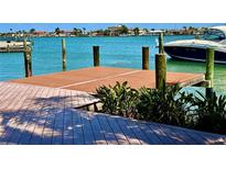 Waterfront property featuring a wooden dock and boat access with beautiful views at 530 59Th Ave, St Pete Beach, FL 33706