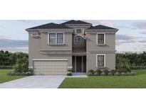Stunning two-story home with a neutral color scheme, manicured lawn, and attached garage at 720 W Peninsular St, Tampa, FL 33603