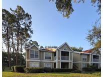 Inviting two-story condo with a screened in porch and mature trees at 9481 Highland Oak Dr # 1003, Tampa, FL 33647