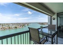 Relax on the balcony and enjoy stunning waterfront views in this coastal community at 9495 Blind Pass Rd # 907, St Pete Beach, FL 33706