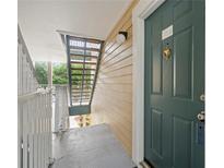 Condo front door, with stairs and entry area, providing access to the residence at 10028 Strafford Oak Ct # 712, Tampa, FL 33624