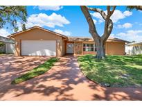Charming single-story home with mature landscaping and a two-car garage, providing an inviting curb appeal at 12467 93Rd Ave, Seminole, FL 33772