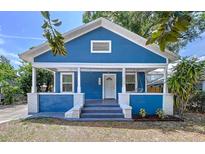 Charming blue home with a cozy front porch and white trim at 3706 N Ola Ave, Tampa, FL 33603