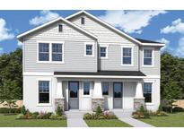Charming two-story home featuring a welcoming entrance and beautifully landscaped front yard, perfect for suburban living at 404 N Westland St # 1, Tampa, FL 33609