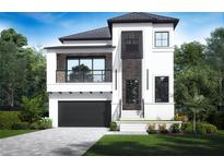 Modern two-story home showcasing clean lines, a balcony, black framed windows, and a well-manicured lawn at 519 W Davis Blvd, Tampa, FL 33606