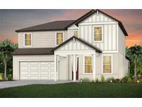 This new construction home boasts vertical siding, and a covered porch entry for a stylish curb appeal at 10537 Longmeadow Ave, Parrish, FL 34219