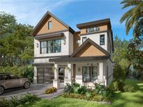Striking two-story home boasting a modern design with unique wood and neutral color accents, plus a convenient attached garage at 3408 W Arch St, Tampa, FL 33607