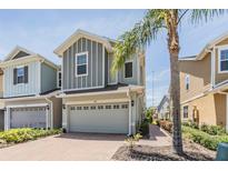 Charming two-story home featuring a brick driveway, attached garage, and pleasant landscaping at 5743 Skytop Dr, Lithia, FL 33547