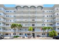 Stunning condominium exterior with multiple balconies and beautiful landscaping at 5925 Shore S Blvd # 611, Gulfport, FL 33707