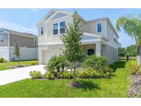 Charming two-story home with manicured lawn and well-maintained landscaping at 7721 Twin Leaf Ter, Parrish, FL 34219