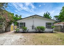 Charming single-story home with a freshly painted exterior and manicured landscaping at 9403 N 13Th St, Tampa, FL 33612