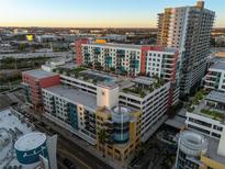 High-rise condo building featuring a rooftop pool and stunning city views at sunset at 1120 E Kennedy Blvd # 1228, Tampa, FL 33602