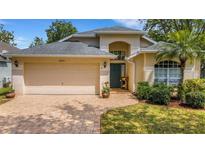 Charming single-Gathering home with a well-manicured lawn and a two-car garage at 16905 Hawkridge Rd, Lithia, FL 33547