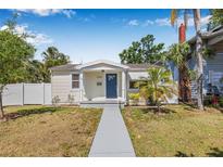 Charming single story home featuring well-maintained landscaping, a walkway, and neutral paint at 3300 Jackson N St, St Petersburg, FL 33704