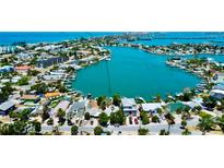 Expansive aerial view of waterfront homes and docks in a charming coastal community at 412 20Th Ave, Indian Rocks Beach, FL 33785
