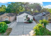 Charming single Gathering home with well maintained landscaping and attached one car garage at 4326 Venice Dr, Land O Lakes, FL 34639