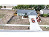 Charming single Gathering home with a well-maintained lawn, mature trees, and a private driveway at 612 Bryan Terrace Dr, Brandon, FL 33511